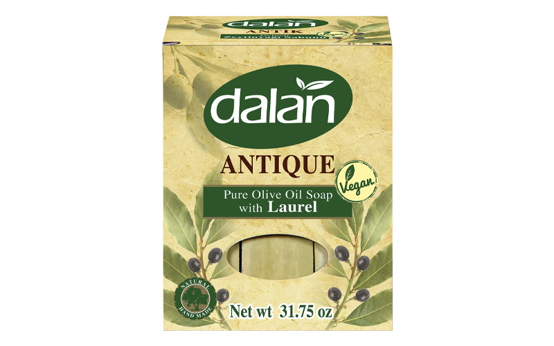 Packaging of Dalan Antique Pure Olive Oil Soap with Laurel, showing the brand name, product name, and a large bar of soap with laurel leaves design.
