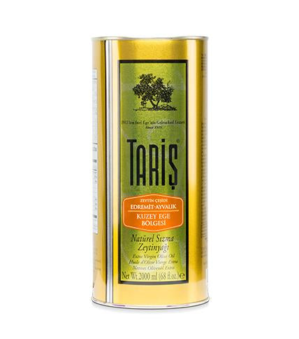 A cylindrical yellow bottle of Taris Extra Virgin Olive Oil with a green label, text, and images indicating it is a product of Turkey.